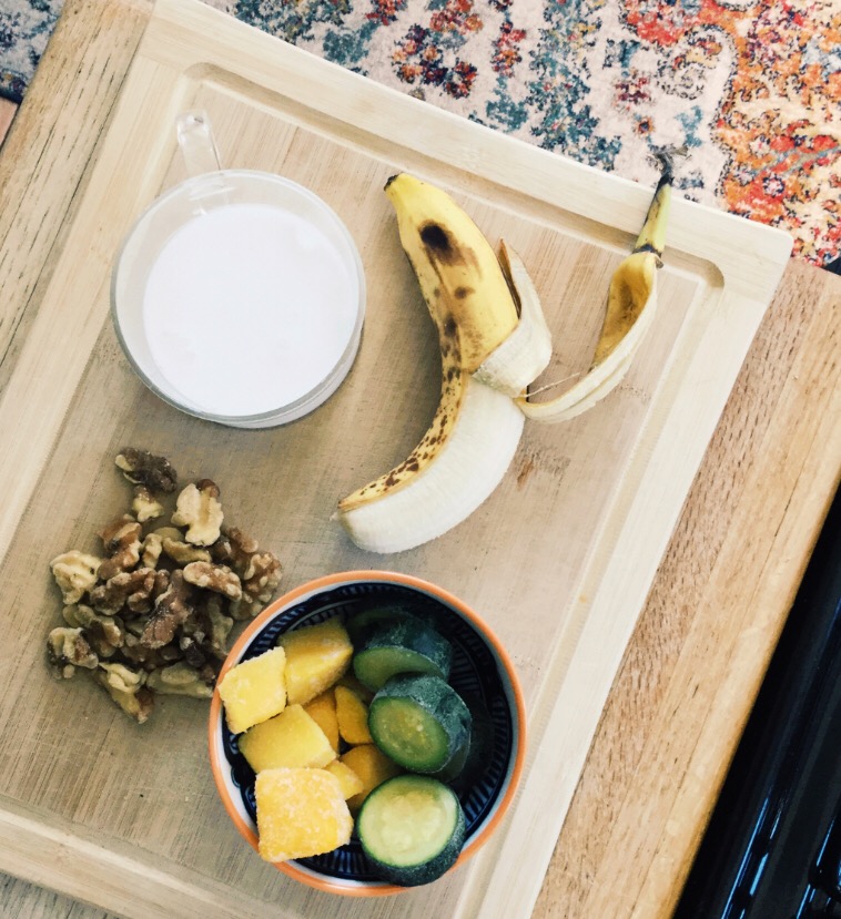 milk nuts banana and other fruit on table