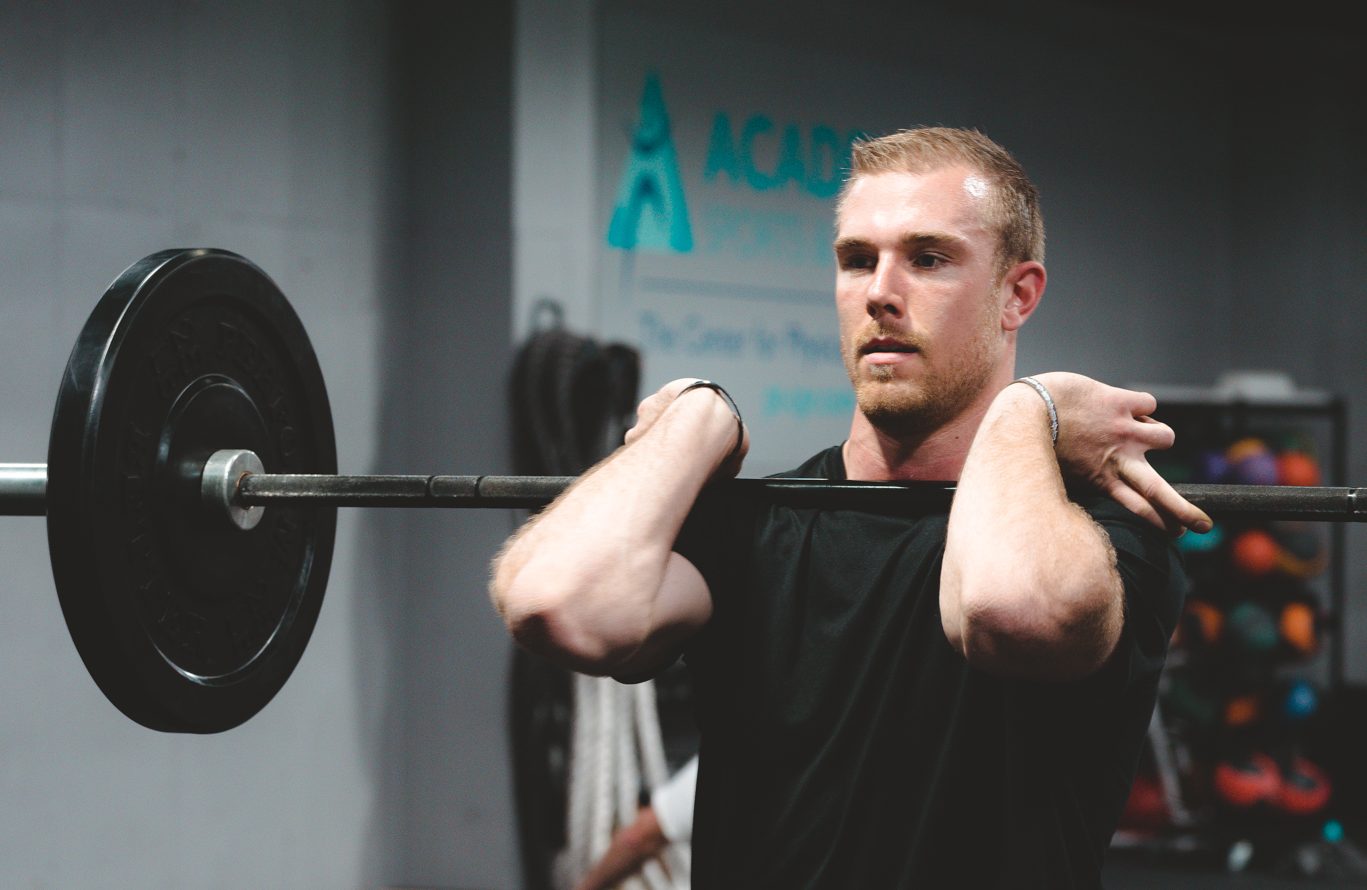 man lifting weights