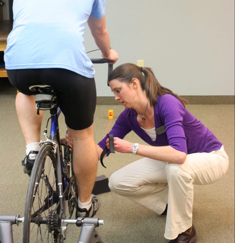 therapist performing bike fit