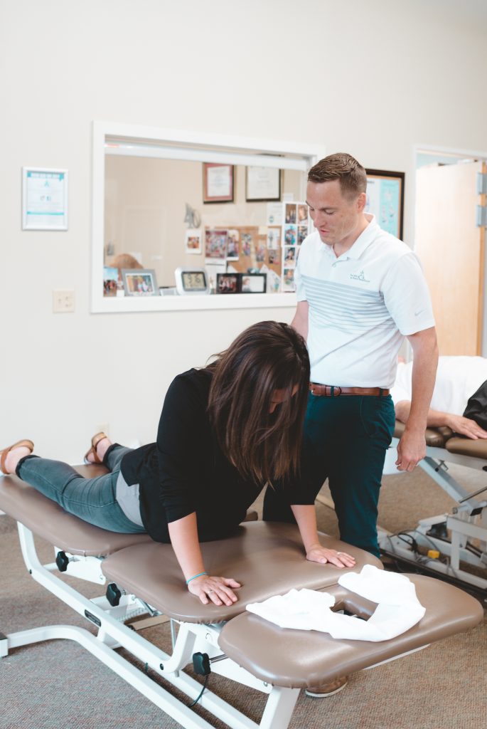 Patient doing back exercise on table