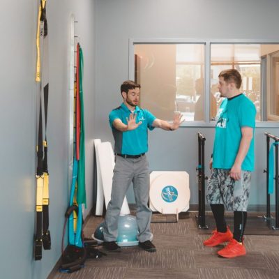 Therapist showing patient an exercise