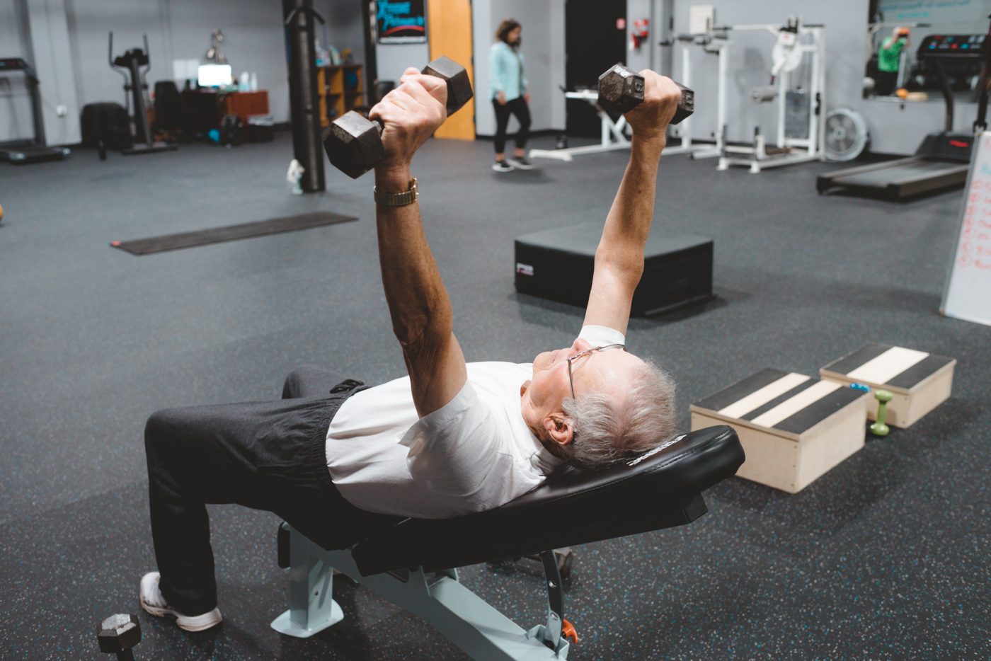 Senior male lifting weights