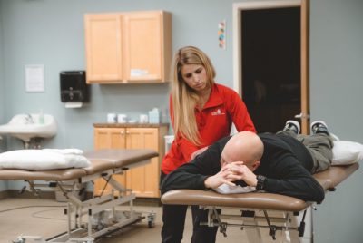 Female Therapist working on male patient