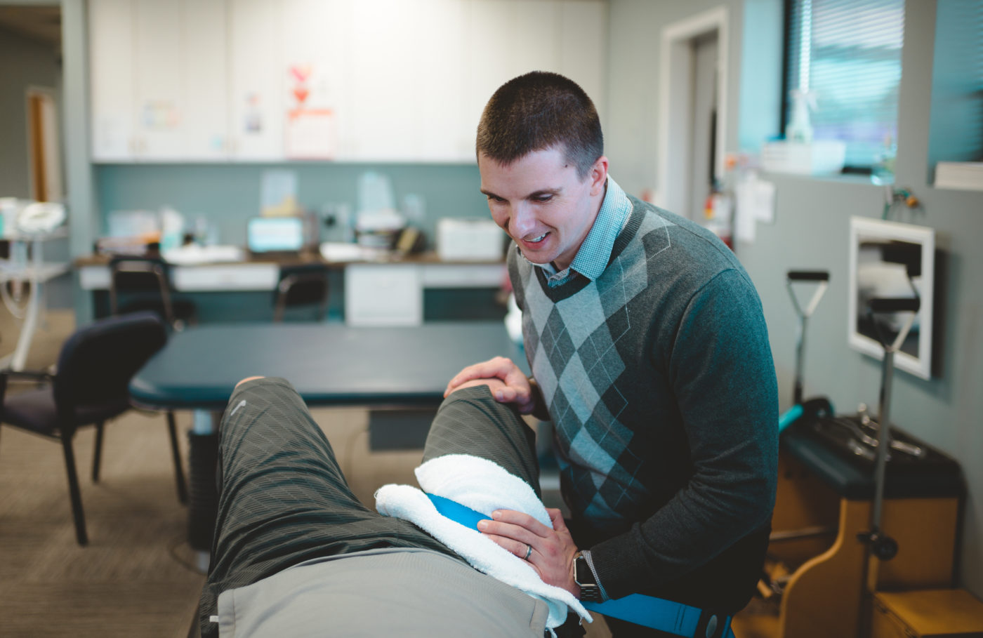 Therapist working on mans hip