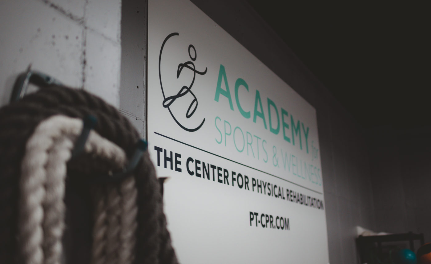 Academy for sports and wellness sign