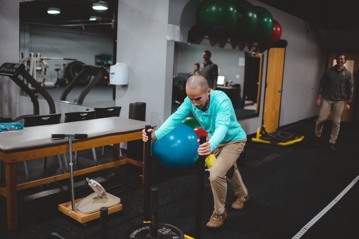 Man pushing weight sled